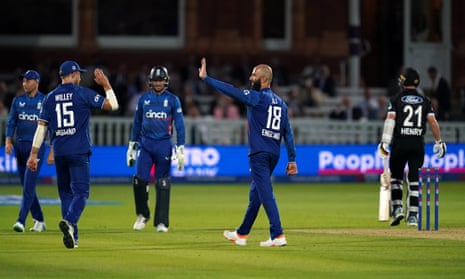 Moeen Ali celebrates a wicket.