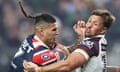 Terrell May of the Roosters is tackled by the Broncos’ Tyson Smoothy
