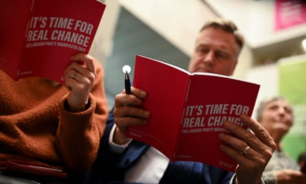 Attendees read copies of the Labour Party election manifesto