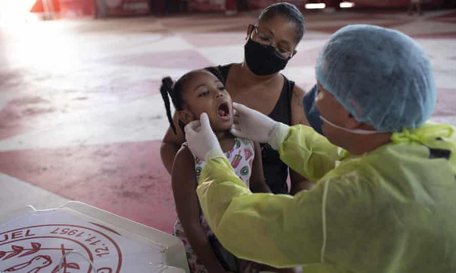 A girl gets a checkup in Rio de Janeiro, Brazil.