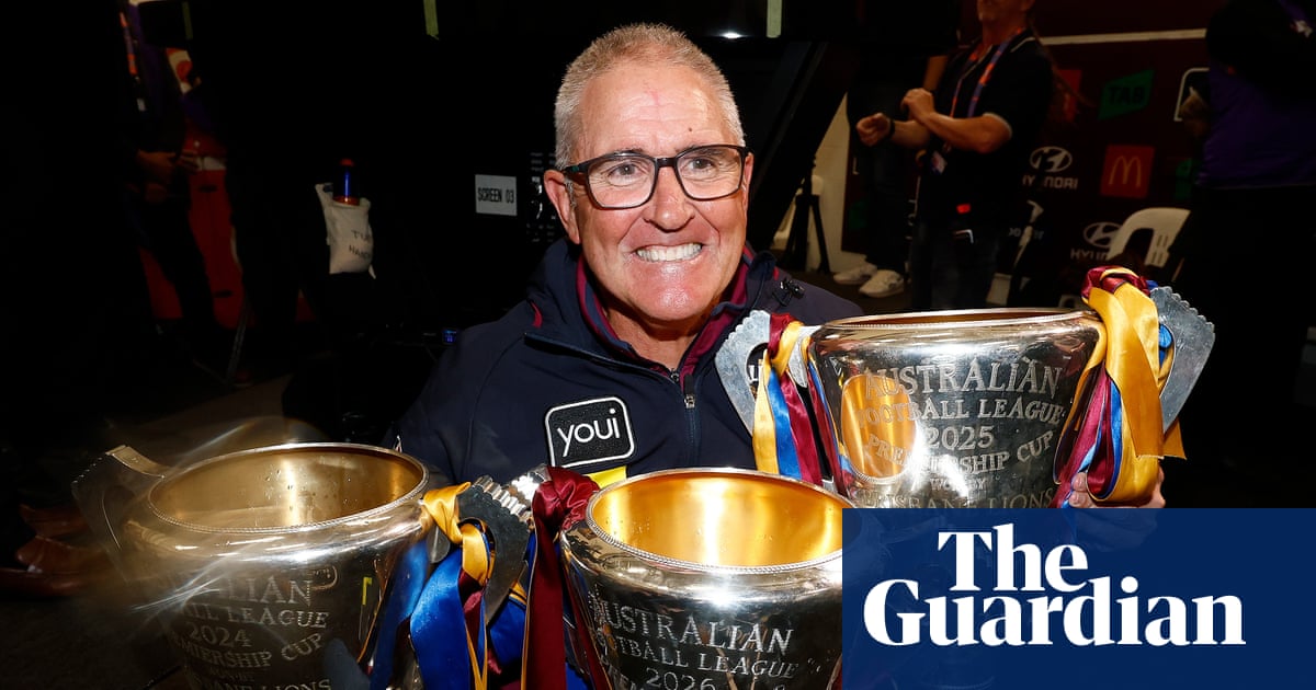 Chris Fagan embracing Charlie Cameron after the 2026 grand final