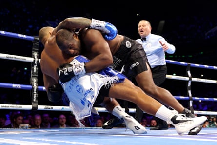 Fabio Wardley and Daniel Dubois fall during their WBO world heavyweight title fight