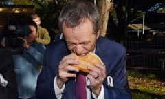 Bill Shorten eats a sausage sandwich at the Strathfield North public school polling booth on election day in July.