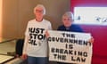 Judy Bruce wears a a just stop oil t-shirt and the Rev Sue Parfitt holds up a sign reading 'the government is breaking the law'.