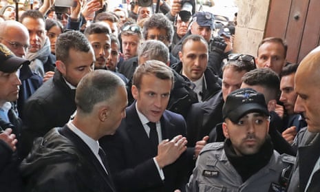 Emmanuel Macron and Israeli security officers in the Church of St Anne, Jerusalem