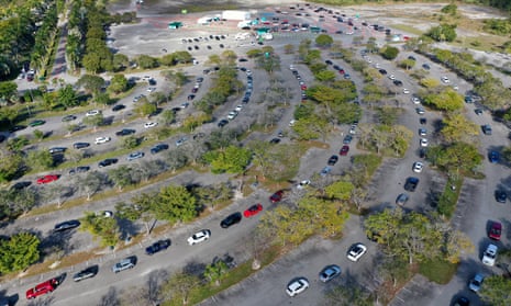 Cars line up at a drive-thru Covid-19 testing site at the Zoo Miami site on Wednesday in Miami, Florida.