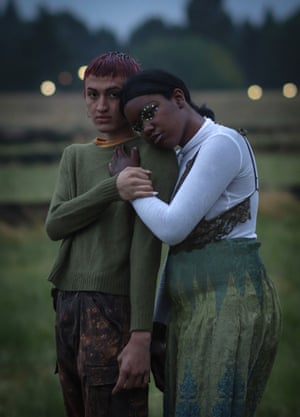 Two homeless transgender teenagers hold each other in a field, Portland, Oregon, US, 2020