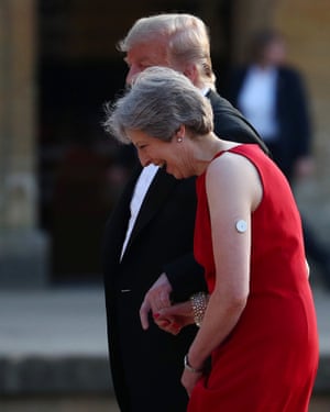 May and Trump holding hands at Blenheim Palace.