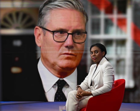 Conservative Party leader Kemi Badenoch before appearing on the BBC1 current affairs programme, Sunday with Laura Kuenssberg, with an image of Keir Starmer behind her.