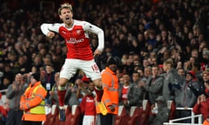 Arsenal’s Nacho Monreal celebrates after his shot was deflected into the net by Leicester City’s Robert Huth to score an own goal and open the scoring.