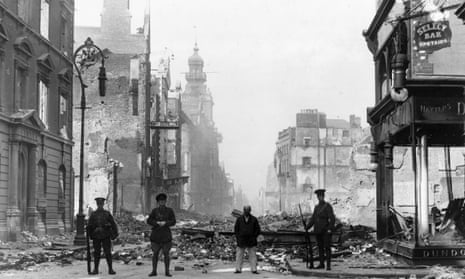 British soldiers stand guard in an area of Dublin destroyed in the 1916 Easter Rising.