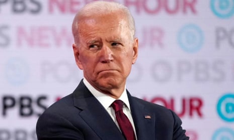 Joe Biden listens to rivals during the sixth Democratic presidential candidates debate, in Los Angeles on 19 December.