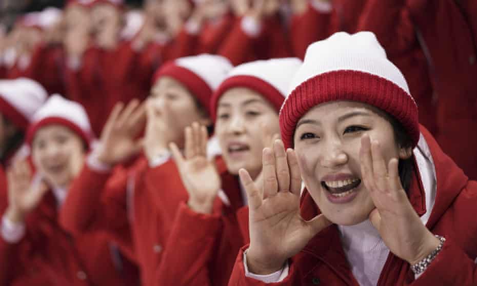 North Korean supporters cheer during the preliminary round of the women’s hockey game between Switzerland and the united Korean team.