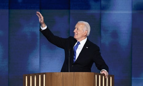 a man in a dark suit and blue tie