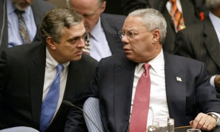 Colin Powell talks with George Tenet after his presentation to the UN security council in 2003.