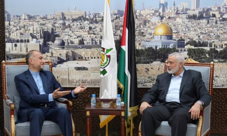 Iran’s foreign minister, Hossein Amir-Abdollahian, speaks with the Hamas chief Ismail Haniyeh in Doha