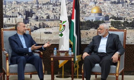Iran’s foreign minister, Hossein Amir-Abdollahian, speaks with Hamas chief Ismail Haniyeh in Doha on 31 October.