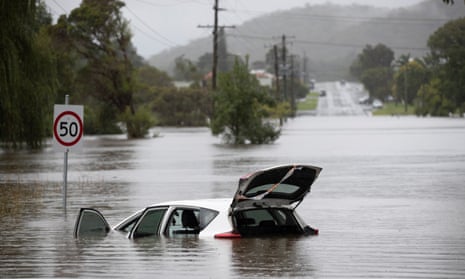 A car stranded in Bulahdelah on Sunday after the Myall River broke its banks.