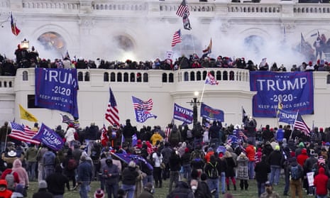 Rioters supporting Donald Trump storm the Capitol in Washington DC on 6 January 2021. Of the more than 160 people arrested by the end of January, almost one in five were current or former members of the military, NPR reported.