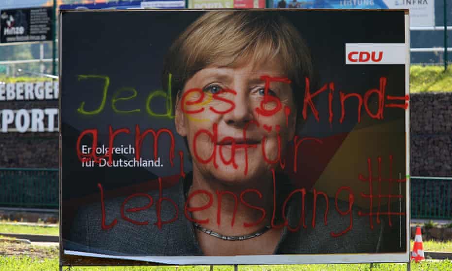 A defaced CDU campaign poster in Schmiedeberg, Germany. The graffitti reads “each fifth child = poverty, therefore life imprisonment”.