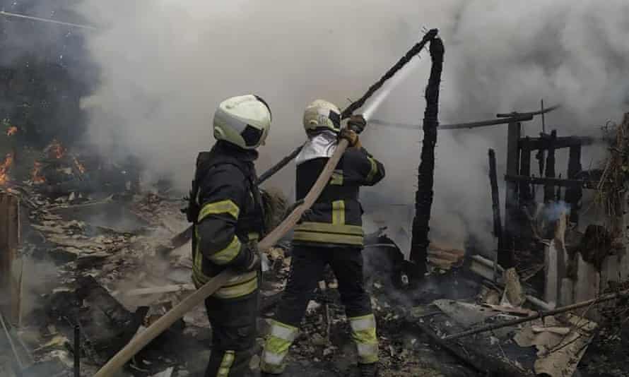 Ukrainian firefighters extinguish a fire at a destroyed residential building in Lysychansk, Luhansk region, on Sunday morning (Luhansk region military administration via AP)