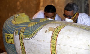 Archaeologists inspect the sarcophagus, which revealed a mummy of a woman called Thuya.