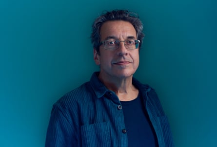 Headshot of Guardian writer George Monbiot against dark turquoise background