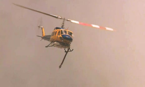 A firefighting helicopter above the suburb of Parkerville, east of Perth.