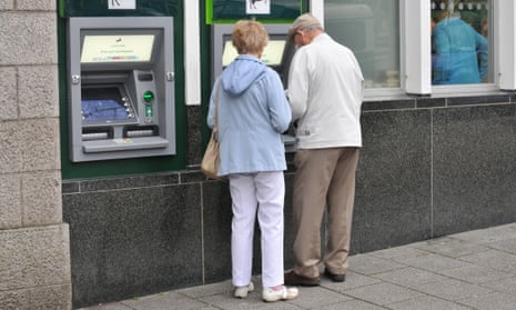 Two pensioners at a cash machine