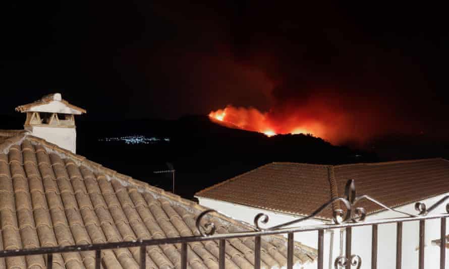 Wildfire seen from a balcony near the town of Pujerra, near Estepona
