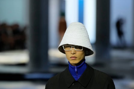 A model wears a raffia cloche hat.