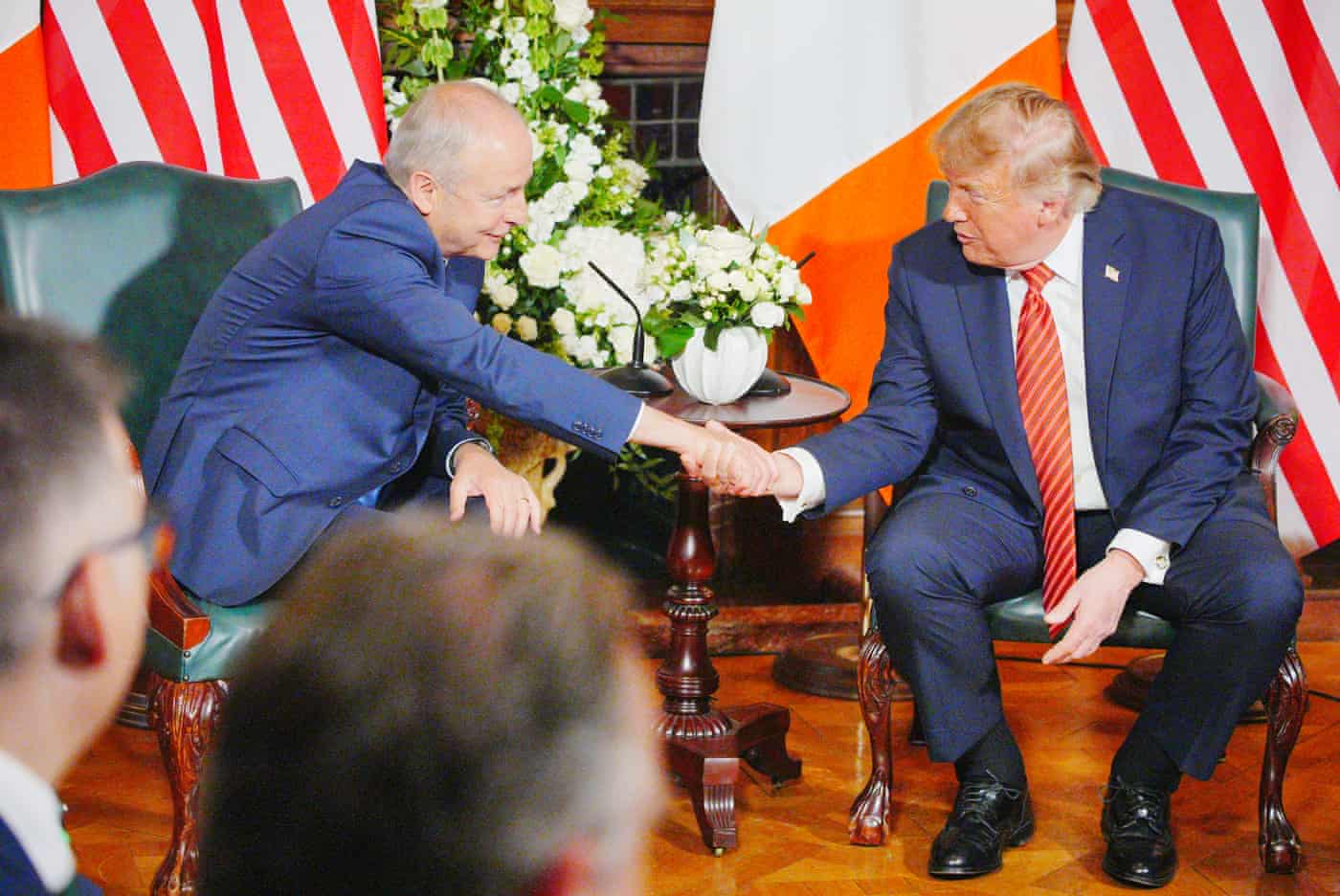 Donald Trump and Micheal Martin shake hands.