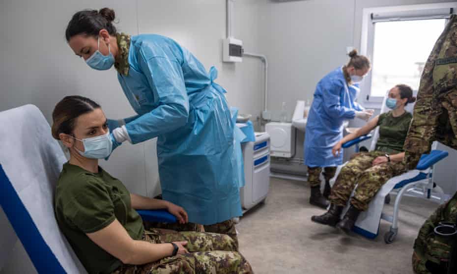 Italian soldiers receive the AstraZeneca Covid-19 vaccine in Rome on Friday.