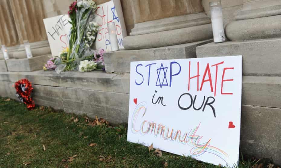 Signs are shown on display outside the Chesed Shel Emeth Cemetery on 22 February in University City, Missouri, which suffered vandalism similar to that at a Jewish cemetery in Philadelphia.