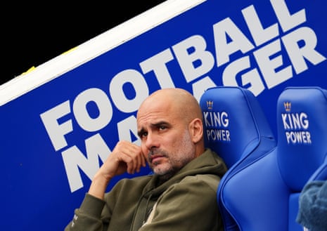 Pep Guardiola sits in the visitors’ dug-out at the King Power Stadium. 