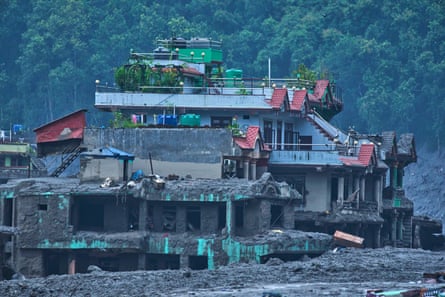 A building half buried in mud.