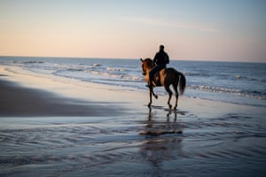 Bouchakour and Peyo enjoy time off on the beach in Calais, after a hard day at the hospital. ‘In the past, people died at home. Today, it is so hard because people are often dying in isolation and we see death as a drama,’ says Bouchakour. ‘It is a unique experience to look after a person who is facing death, to stay with them and tell them: “Don’t worry, you can go in peace, you won’t be forgotten”.’