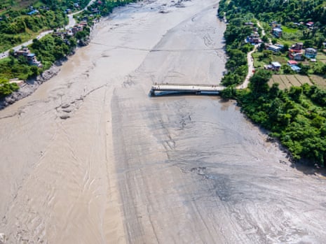 An aerial view shows flooding along the Bhotekoshi River affecting low-lying areas and settlements near the riverbanks in Nuwakot, Nepal.