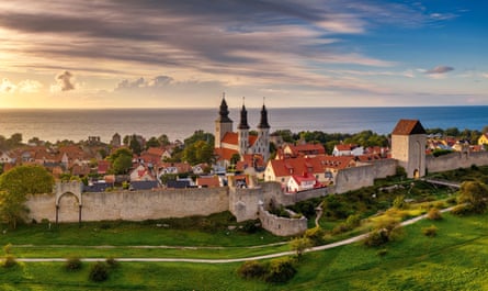 Walled old town on an island in evening light.