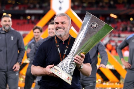 Postecoglou celebrates with the Europa League trophy after his team’s victory over Manchester United.
