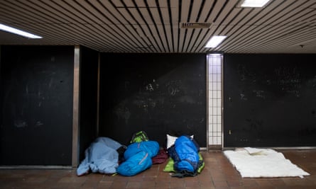 Three rough sleepers in an underpass in central London.