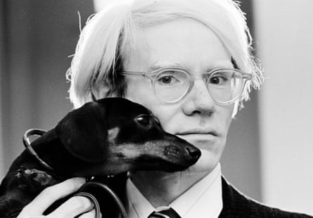 Andy Warhol cuddles his dog