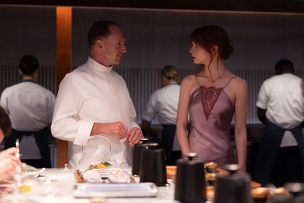 Ralph Fiennes and Anya Taylor-Joy in The Menu.