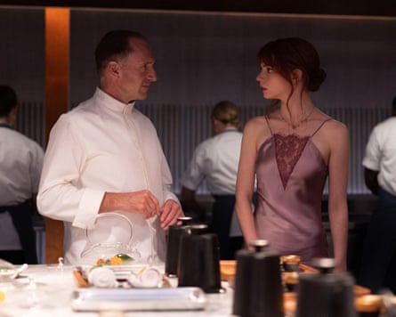 Ralph Fiennes and Anya Taylor-Joy in The Menu.