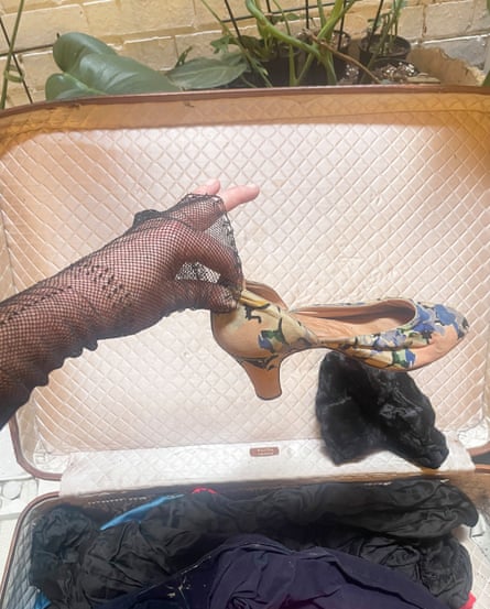 Inside one of the suitcases - a small dress-up shoe and ... fishnet.