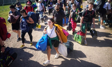 People arrive on the first day of the Glastonbury festival at Worthy Farm in Somerset. 