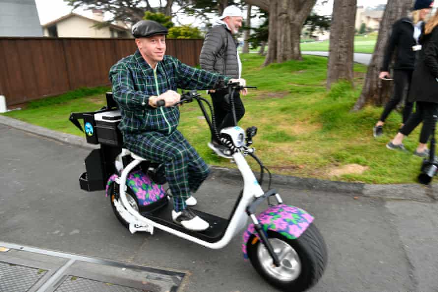 Macklemore rides a scooter during the third round of the AT&T Pebble Beach Pro-Am golf tournament.