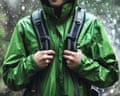 Young Man Hiking in Rain with Waterproof Jacket