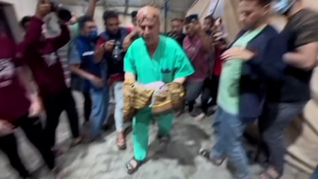Gaza medics pull baby from womb of mother killed in Israeli airstrike – video