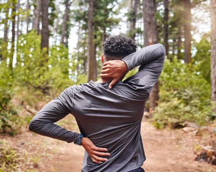A man feels his aching backmost and neck